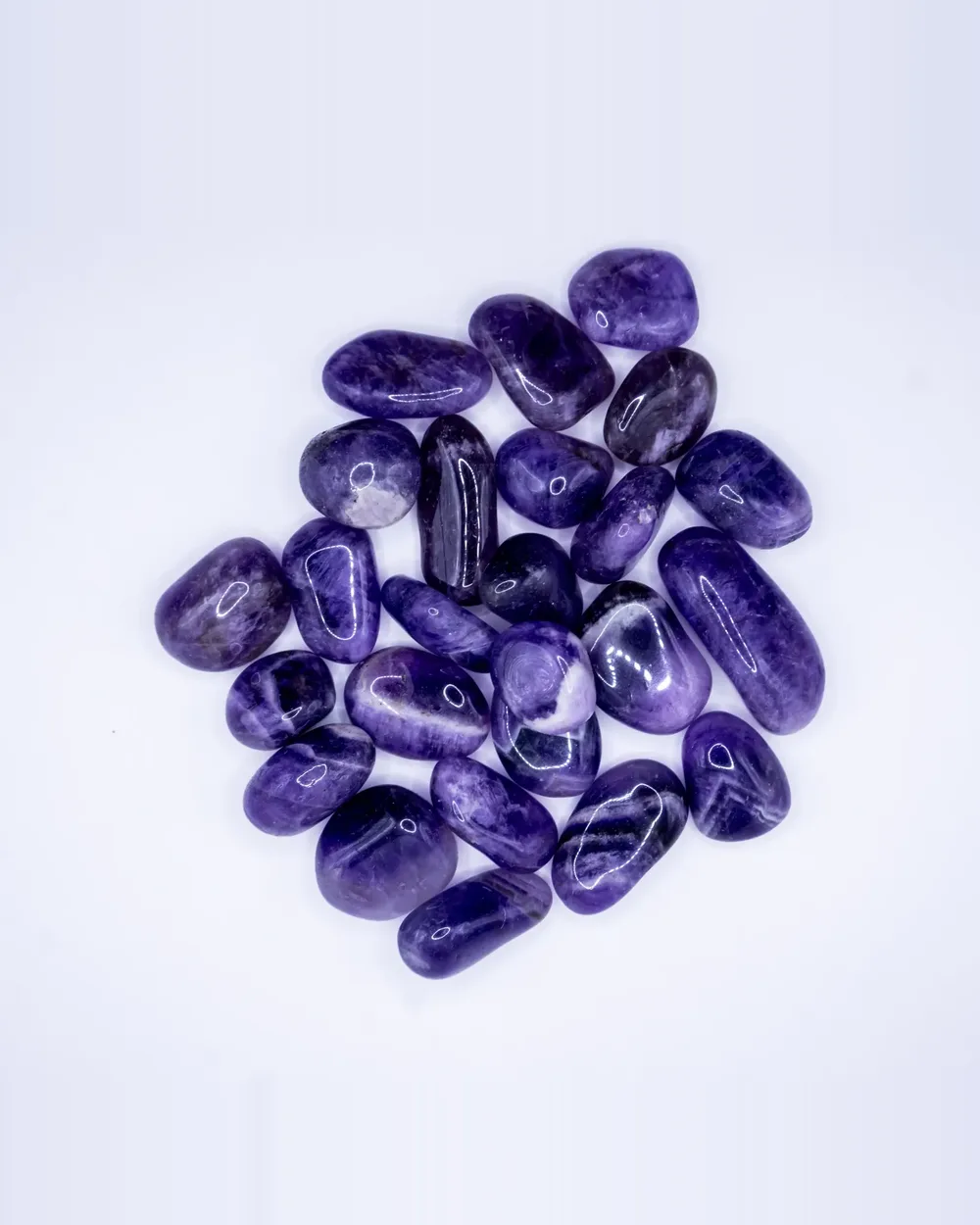 Amethyst tumbled stone, a group of polished stones